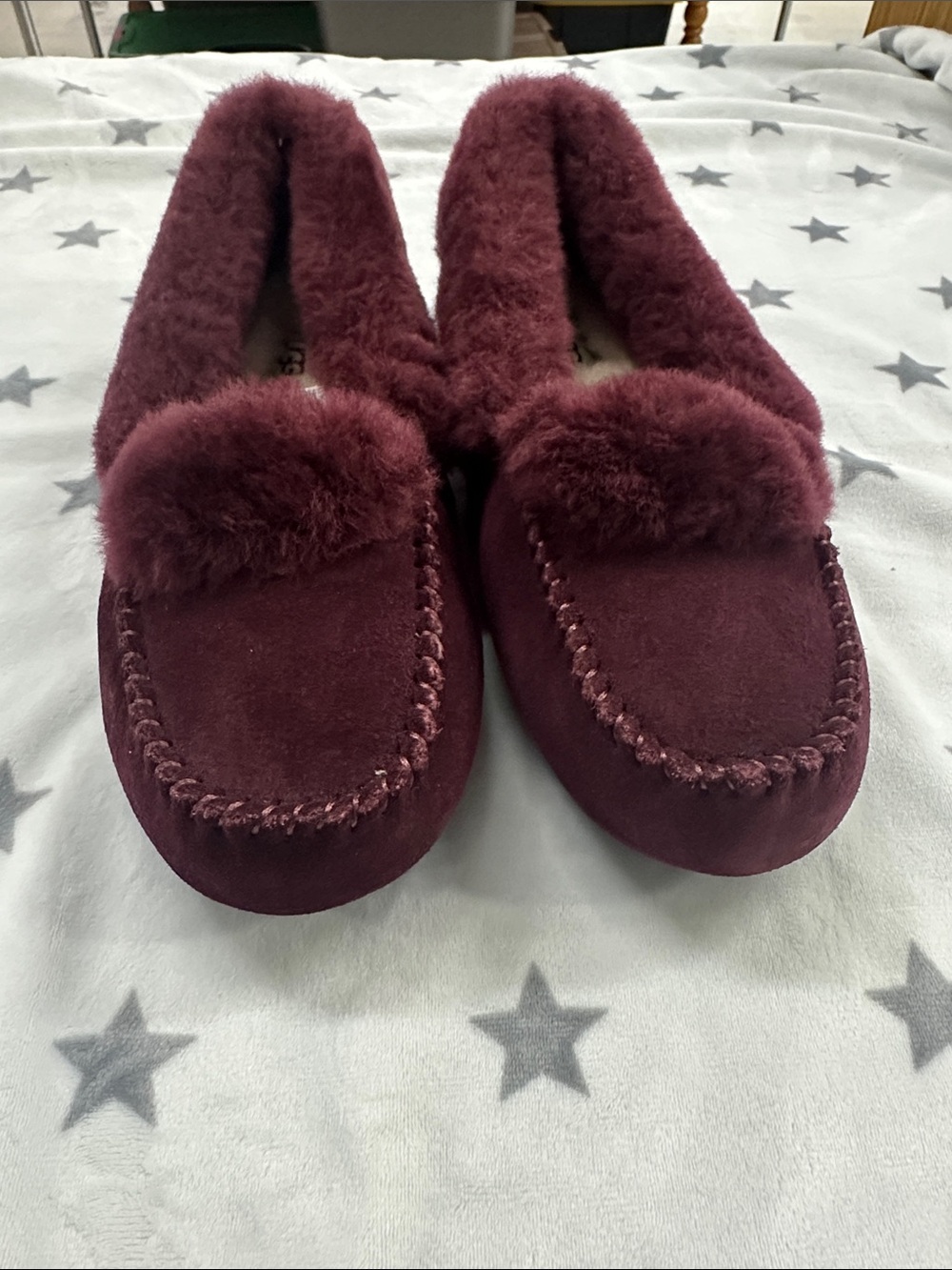 UGG Women's Burgundy Dakota Spill slipper.